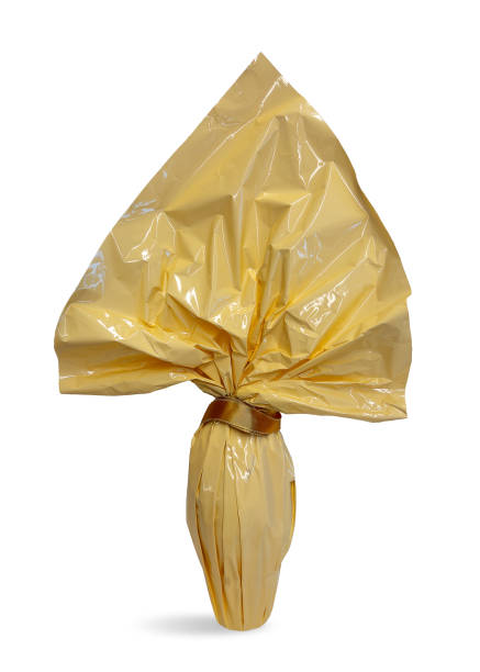 istock Easter chocolate egg wrapped in paper cream colored 2202144134