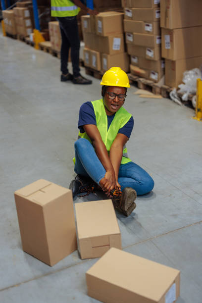 istock Warehouse worker suffering from ankle pain after workplace accident 2202145704