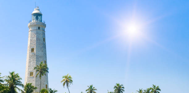 istock White lighthouse Dondra Head and tropical palms, Sri Lanka, near Matara. 2202145743