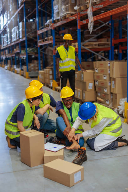 istock Doctor examining injured warehouse worker after accident at work 2202146238