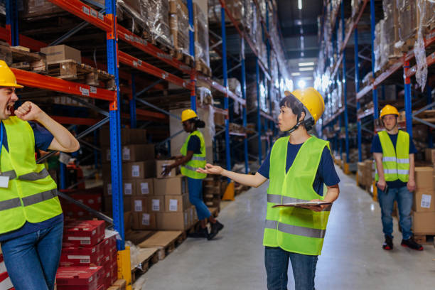 istock Warehouse workers organizing goods in a storage room 2202146239
