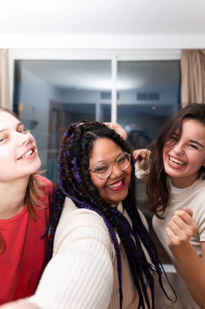 istock Three young women taking a selfie and having fun 2202148124