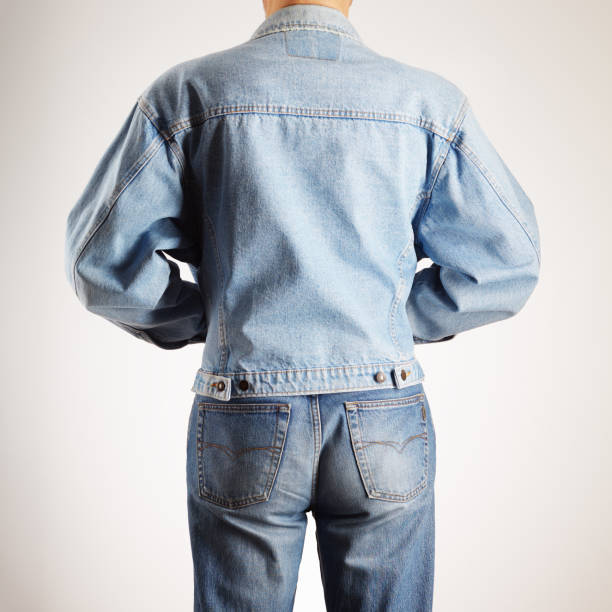 istock Rear view of a man in old fashioned double denim jacket and jeans 2202148548