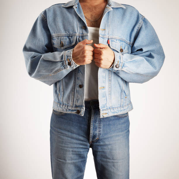 istock Man in old fashioned double denim jacket and jeans 2202148587