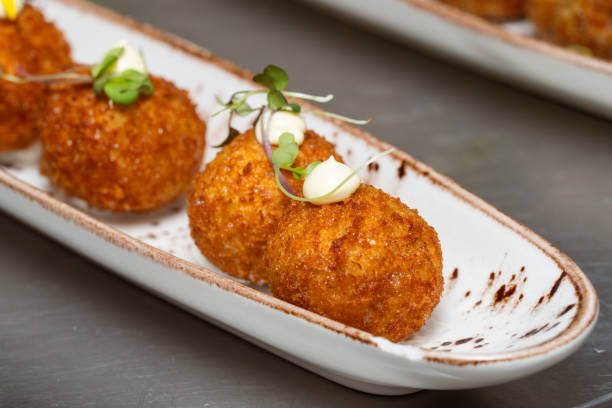 Croquettes served on a modern white plate