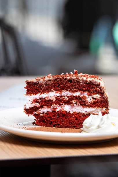 istock Red velvet cake slice with cream cheese frosting 2202149836