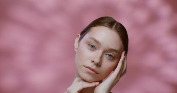 istock Caucasian model with natural beauty posing, touching her face with her hands 2202151420
