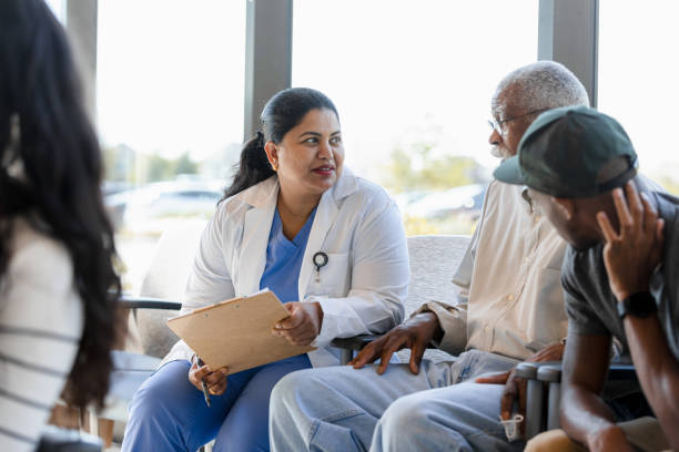 istock Group Therapy Session: Doctor Talking with Patients 2202151462