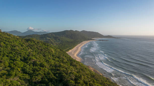 Set of mountains with beach and sea at dawn
