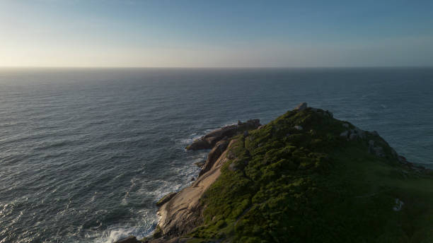 istock Set of mountains with beach and sea at dawn 2202154541