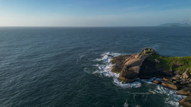 istock Stones in the sea at dawn 2202154568