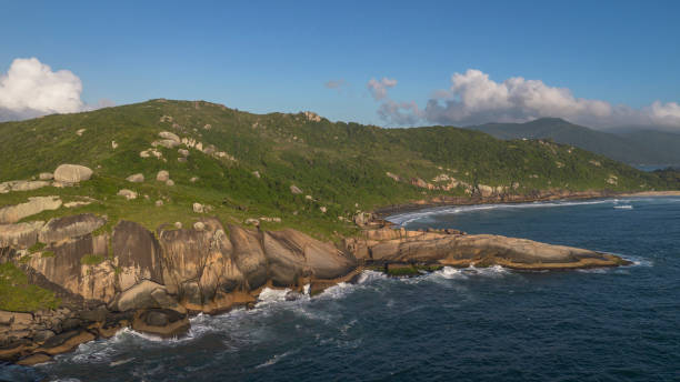Set of mountains with beach and sea at dawn