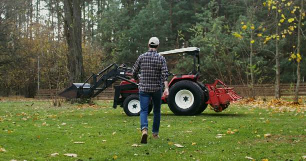 istock A young man gets into a tractor, getting ready to work in field on autumn day 2202155411