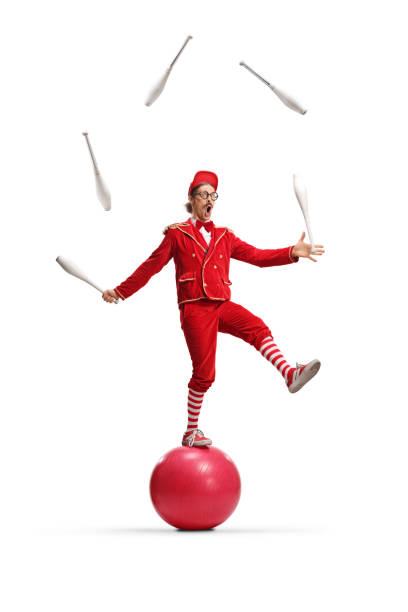 Clown is juggling with hats