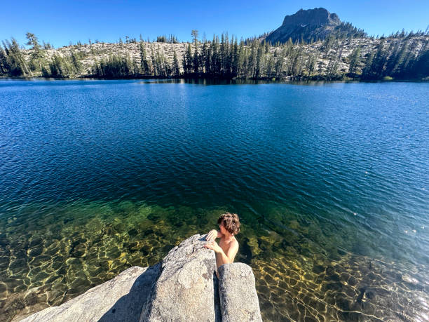 istock Alpine lake cold plunge on vacation 2202157142