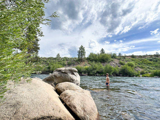 istock Teenager cold plunging in the Truckee River 2202157149