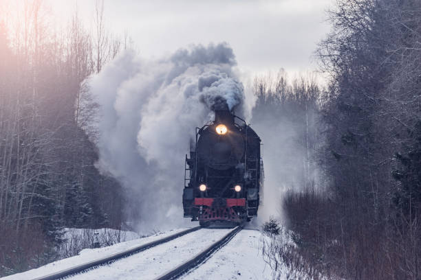 istock Retro steam train moves at winter. 2202158943