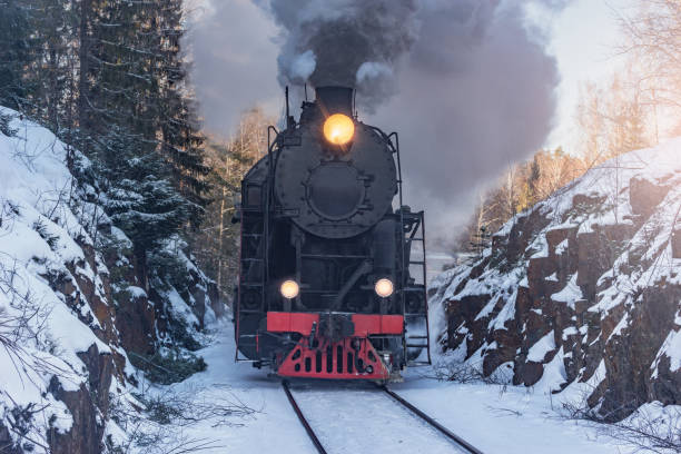 istock Retro steam train moves at winter morning. 2202158971