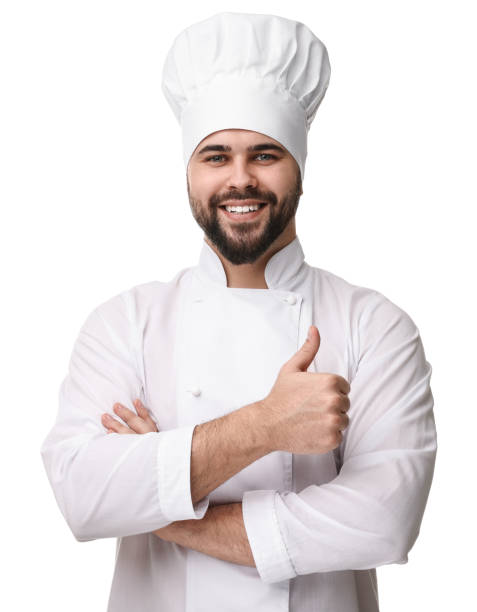 istock Happy young chef in uniform showing thumb up on white background 2202160767