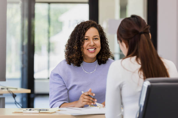 istock Cheerful Latina therapist in counseling session with patient 2202161373