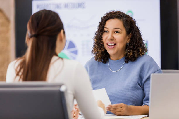 istock Businesswomen Meeting, Discussing Ideas, Showing Teamwork 2202161389