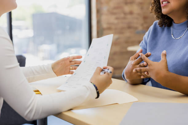 istock Two Women in a Counseling Session, Discussing Important Issues 2202161424