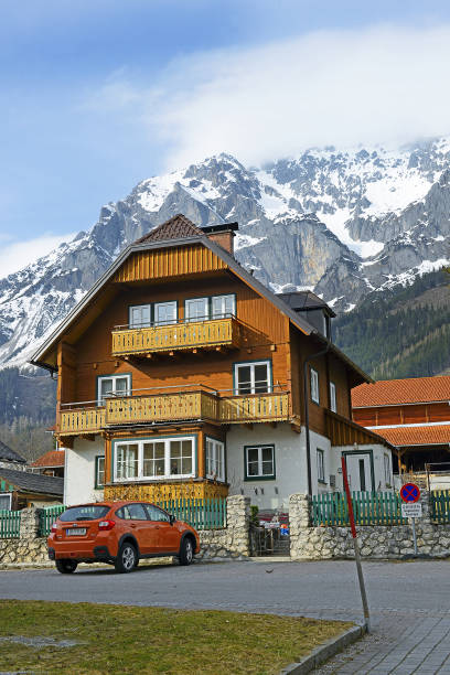 Houses in Ramsau, mountain peaks. Known mountain resort under a massive Dachstein near Schladming, Austria