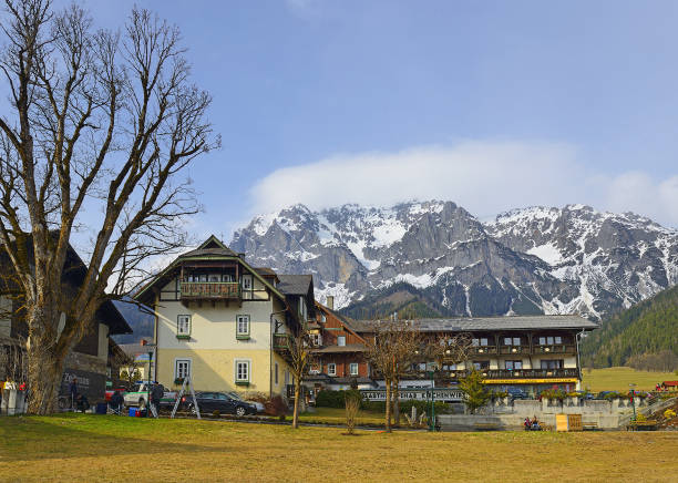 Houses in Ramsau, mountain peaks. Known mountain resort under a massive Dachstein near Schladming, Austria