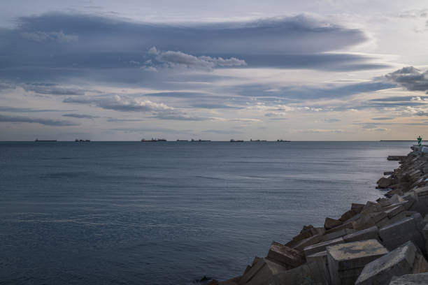 istock Cargo ships sailing on the horizon in Barcelona, Spain. 2202169168