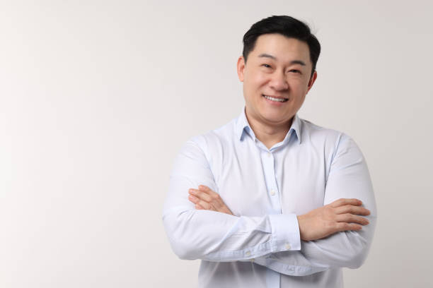 istock Portrait of happy man on light background. Space for text 2202171269