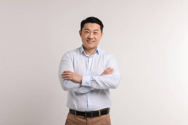 istock Portrait of happy man on light background 2202171306