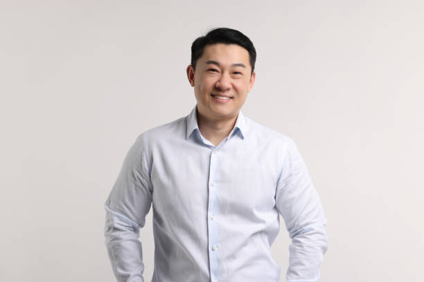 istock Portrait of happy man on light background 2202171336