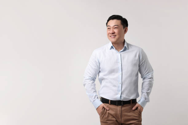 istock Portrait of happy man on light background. Space for text 2202171436
