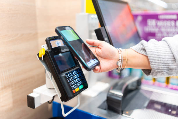 istock Customer paying contactless with smartphone 2202171805