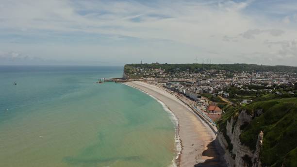 istock A town located on the coast among sheer cliffs with a natural arch 2202173561