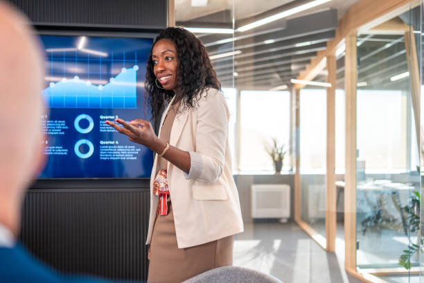 istock Black Female Financial Advisor Conducts Presentation 2202175408