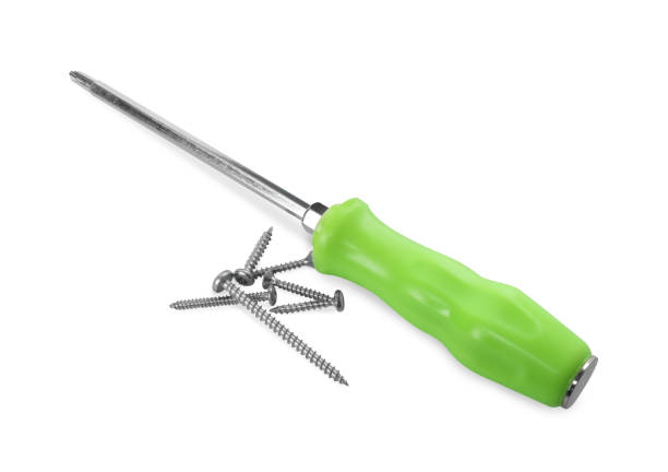 Screwdriver with green handle and screws isolated on white, above view