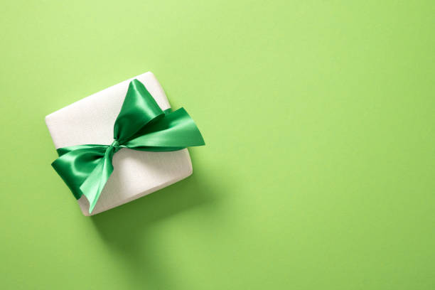 istock St Patricks day concept with symbols, gift on green background. 2202186303