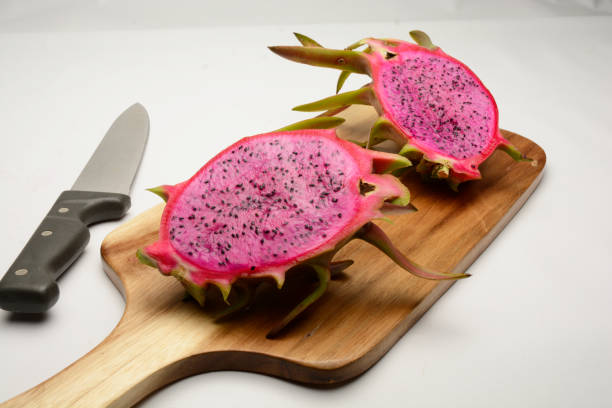 istock Sliced Dragon Fruit On Cutting board With Knife 2202190238