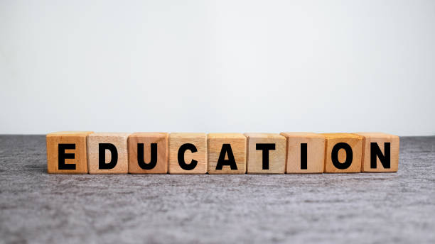 istock education word symbol on wooden blocks on the table 2202190780