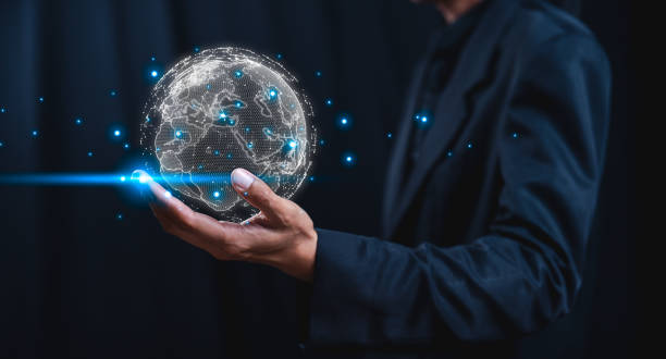 istock A person holds a glowing, digital globe in one hand, symbolizing technology, connectivity, and the future. 2202190801