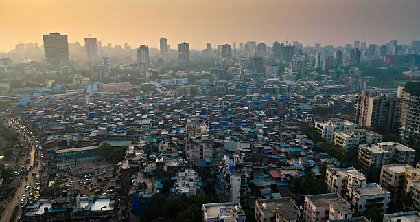 Aerial shot of blue houses in Bandra, a suburb in Mumbai, India at sunset.