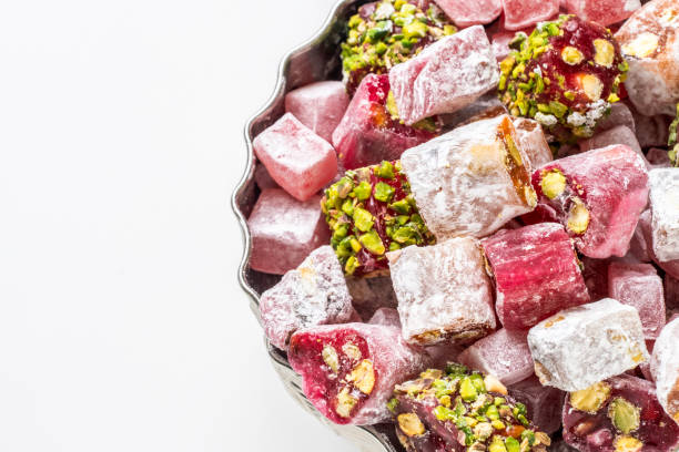 Turkish delight in traditional bowl over white background, Close up