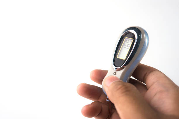 Close-up a hand gripping a compact digital counter. Ideal for tally counting dhikr or fitness tracking with a modern and practical style.
