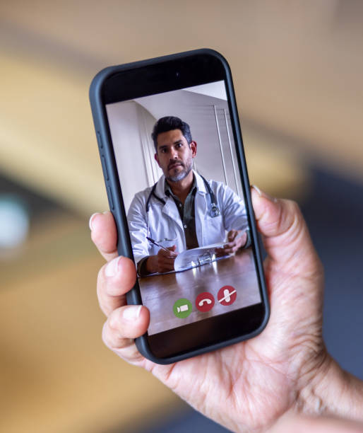 istock Close-up on a doctor talking to a patient on a video call 2202195080