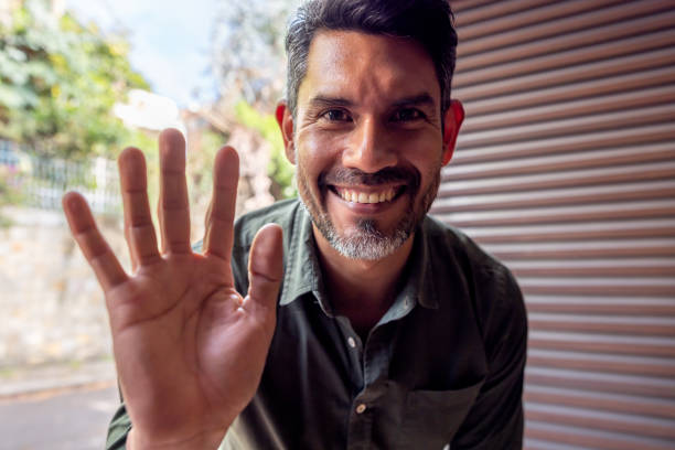 istock Man arriving at a house and announcing himself on the intercom 2202196845