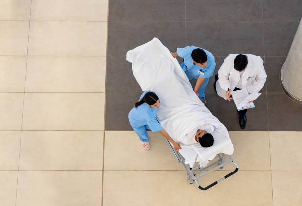Empty stretcher bed gurney in hospital corridor.