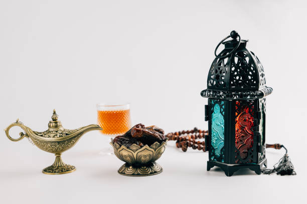 istock Holy Ramadan setup with dates in an ornate bowl, decorative lantern, and vintage lamp 2202201484