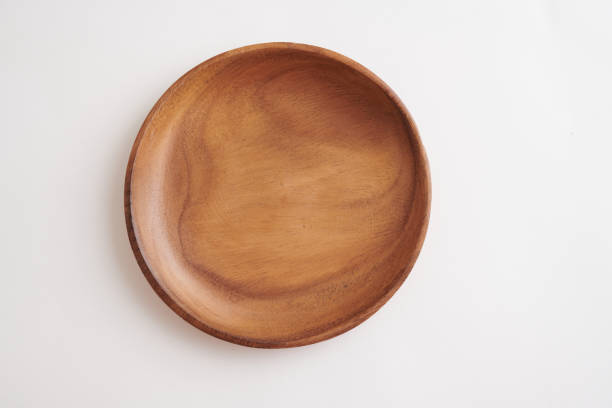 istock Round Wooden Plate with Smooth Finish on White Background. Top view 2202202291