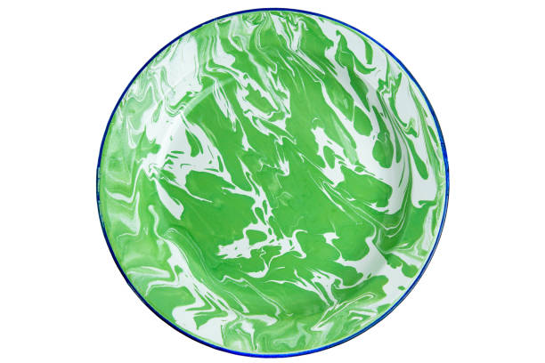 istock An old indonesian plate with green stripes on a white background. 2202203229